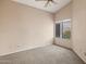 Bedroom featuring plush carpet, a window with a view, and neutral-colored walls at 5 W Ranch Rd, Tempe, AZ 85284