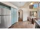 Charming kitchen with blue cabinets, stainless steel appliances, and breakfast nook with terra cotta tile at 5 W Ranch Rd, Tempe, AZ 85284