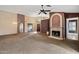 Expansive living room with carpet, fireplace, and sliding glass door access to the backyard, perfect for entertaining at 5 W Ranch Rd, Tempe, AZ 85284