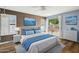 Relaxing main bedroom suite with blue accents, patio access, and wood flooring at 5 W Ranch Rd, Tempe, AZ 85284