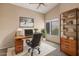 Inviting home office with vaulted ceiling, modern desk, and a cozy rug at 5 W Ranch Rd, Tempe, AZ 85284