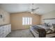 Spacious bedroom showcases a ceiling fan and bright, natural light at 515 S Apache Dr, Chandler, AZ 85224