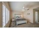 Large bedroom features neutral colors, a ceiling fan, and natural light at 515 S Apache Dr, Chandler, AZ 85224