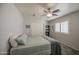Bedroom with gray carpet, light walls, neutral bedding, and a window with plantation shutters at 515 S Apache Dr, Chandler, AZ 85224