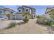 Two-story home boasts desert landscaping, neutral stucco, and a large two-car garage at 515 S Apache Dr, Chandler, AZ 85224