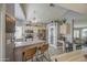 Bright eat-in kitchen featuring stainless appliances, tile floors, and light wood cabinetry at 515 S Apache Dr, Chandler, AZ 85224
