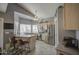 Bright kitchen with stainless appliances, light wood cabinetry, and a casual dining space at 515 S Apache Dr, Chandler, AZ 85224