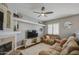 Cozy living room with fireplace, stylish decor, and a comfortable reclining sofa at 515 S Apache Dr, Chandler, AZ 85224