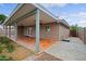 The back patio has ceiling fans, a tile floor, and views of the yard at 6120 W Keim Dr, Glendale, AZ 85301
