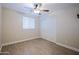 Comfortable bedroom featuring modern flooring, ample natural light, and closet at 6120 W Keim Dr, Glendale, AZ 85301