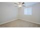 Bright and simple bedroom with modern flooring, closet, and a ceiling fan at 6120 W Keim Dr, Glendale, AZ 85301