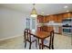 Cozy dining area with kitchen view, complete with stylish lighting at 6120 W Keim Dr, Glendale, AZ 85301