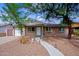 Charming single-story home featuring a well-manicured front yard and inviting walkway at 6120 W Keim Dr, Glendale, AZ 85301