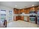 Beautiful kitchen with stainless steel appliances, granite countertops, and stylish wood cabinetry at 6120 W Keim Dr, Glendale, AZ 85301