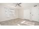 Bright bedroom with a ceiling fan, closet, and a window with white curtains at 6130 E Windsor Ave, Scottsdale, AZ 85257