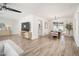 Open living room featuring wood flooring, modern furnishings, a ceiling fan, and dining area at 6130 E Windsor Ave, Scottsdale, AZ 85257