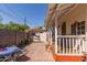 Wide backyard with patio, outbuilding, wooden deck, and a table for outdoor enjoyment at 711 E Mckinley St, Phoenix, AZ 85006