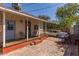 Backyard patio with wooden deck and view of a parked car at 711 E Mckinley St, Phoenix, AZ 85006