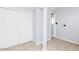 Neutral toned basement with closet and view into a nearby bathroom at 711 E Mckinley St, Phoenix, AZ 85006
