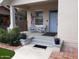Charming front porch featuring two blue Adirondack chairs, perfect for relaxing outdoors at 711 E Mckinley St, Phoenix, AZ 85006