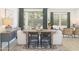 Open dining room features a large table, stylish chairs, and access to an outdoor view at 7646 W Park St, Laveen, AZ 85339