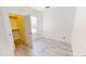 Bright bedroom featuring wood-look floors and a walk-in closet at 7730 E Boise St, Mesa, AZ 85207