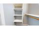 Walk-in closet has wooden dowel and shelving for organized storage at 7730 E Boise St, Mesa, AZ 85207