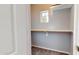 Walk-in closet offering ample storage space with shelving and hanging rods at 7730 E Boise St, Mesa, AZ 85207
