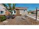 Beautiful, single-story home featuring desert landscaping, a tile roof, and an inviting facade at 7730 E Boise St, Mesa, AZ 85207
