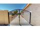 Wrought iron driveway gate adds security and curb appeal to this beautiful home at 7730 E Boise St, Mesa, AZ 85207