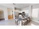 Modern kitchen with stainless appliances, white cabinets, granite countertops, and seated island at 7730 E Boise St, Mesa, AZ 85207