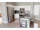 Modern kitchen featuring stainless steel appliances, granite counters, and white cabinets at 7730 E Boise St, Mesa, AZ 85207