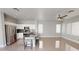 Open-concept kitchen with an island, stainless steel appliances, and modern fixtures at 7730 E Boise St, Mesa, AZ 85207