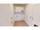 Practical laundry room with built-in cabinets for efficient organization at 7730 E Boise St, Mesa, AZ 85207