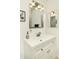 Bright bathroom vanity with a white countertop and cabinet and a decorative soap dispenser at 8626 E Windsor Ave, Scottsdale, AZ 85257