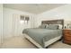 Comfortable bedroom featuring a queen-size bed, natural light from window, and neutral-toned carpet at 8626 E Windsor Ave, Scottsdale, AZ 85257