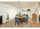 Cozy dining room with a round wooden table and stylish decor, perfect for Gathering meals at 8626 E Windsor Ave, Scottsdale, AZ 85257
