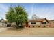 Charming single-story home with a mature shade tree in a well-kept, xeriscaped front yard at 8626 E Windsor Ave, Scottsdale, AZ 85257