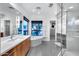 Bright bathroom featuring a modern tub, walk-in shower, and wooden cabinetry at 12809 N 67Th St, Scottsdale, AZ 85254