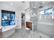 Spacious bathroom featuring a modern tub, walk-in shower, and dual sink vanity at 12809 N 67Th St, Scottsdale, AZ 85254