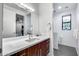 Stylish bathroom with wood vanity, quartz countertop, and modern fixtures at 12809 N 67Th St, Scottsdale, AZ 85254