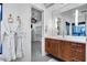 Modern bathroom featuring sleek vanity, elegant fixtures, and a glimpse into the walk-in closet at 12809 N 67Th St, Scottsdale, AZ 85254