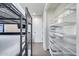 Bedroom with bunk beds and access to storage with shelving at 12809 N 67Th St, Scottsdale, AZ 85254