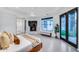 Bright bedroom with a fireplace, outdoor access, modern flooring, and recessed lights at 12809 N 67Th St, Scottsdale, AZ 85254