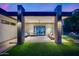 Inviting covered patio with comfortable seating, stylish decor, and a view of the landscaped backyard at 12809 N 67Th St, Scottsdale, AZ 85254