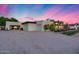 Spacious home with a wide driveway, desert flora, and a modern architectural design at 12809 N 67Th St, Scottsdale, AZ 85254