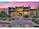 Modern home featuring desert landscaping, stone accents, and a grand entrance with ample natural light at 12809 N 67Th St, Scottsdale, AZ 85254