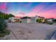 Expansive home with gravel driveway, a two-car garage, and desert-friendly landscaping at 12809 N 67Th St, Scottsdale, AZ 85254