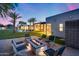 Backyard with a fire pit, pool and a covered patio with views of the main house at 12809 N 67Th St, Scottsdale, AZ 85254