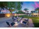 Inviting backyard fire pit area with seating, ideal for relaxing evenings at 12809 N 67Th St, Scottsdale, AZ 85254